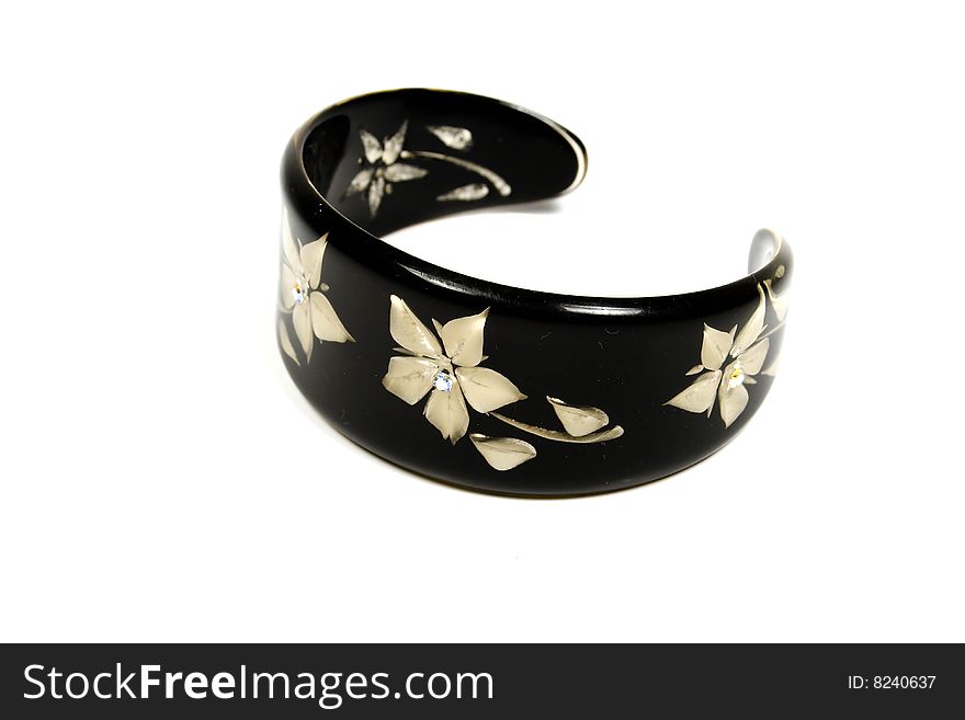 Black bracelet with decoration from flowers and gems