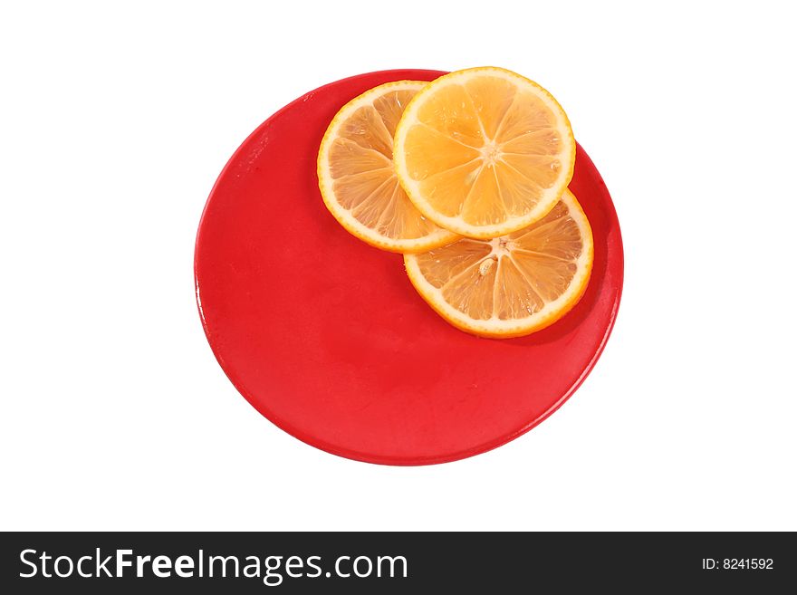 Three slice of orange on a red plate isolated on white. Three slice of orange on a red plate isolated on white