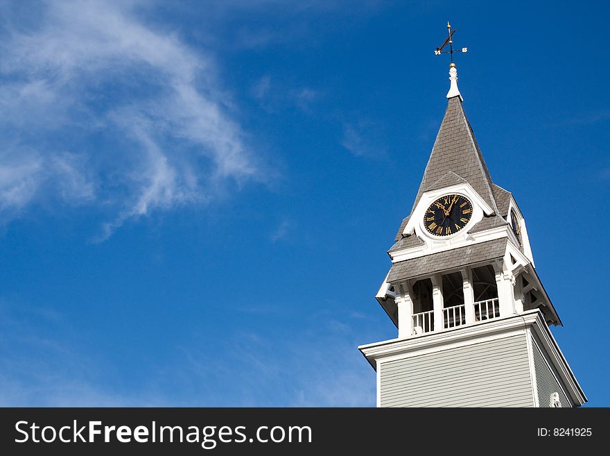 Clock tower at  Cape Cod town with blue sky as background. Clock tower at  Cape Cod town with blue sky as background