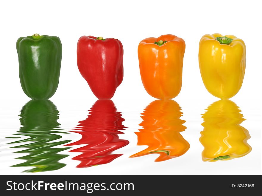 Pepper vegetables in the colors of green, red, orange and yellow with reflection over rippled water, set against a white background. Pepper vegetables in the colors of green, red, orange and yellow with reflection over rippled water, set against a white background.