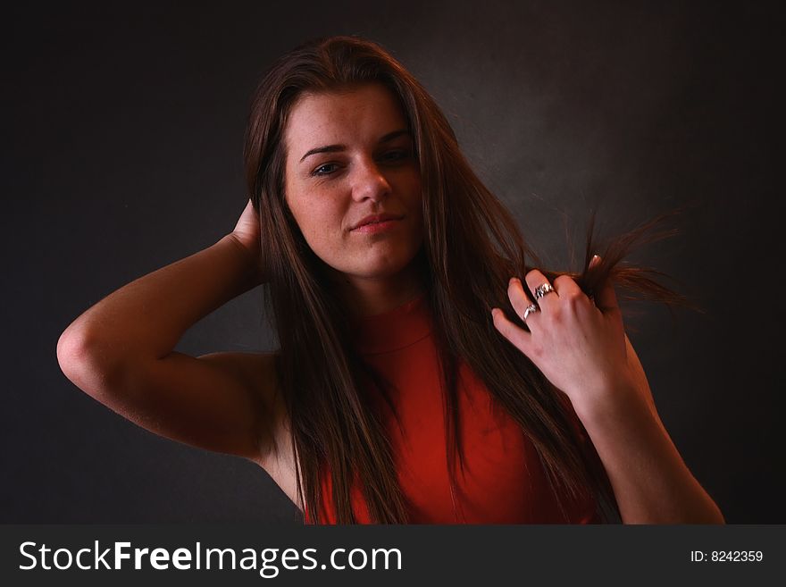 Young attractive girl in the soft studio light. Young attractive girl in the soft studio light.