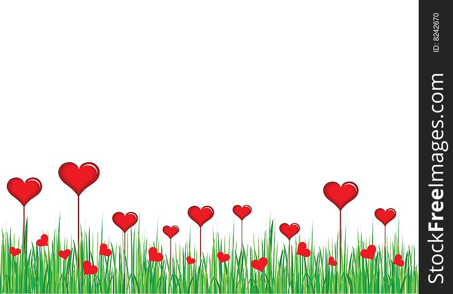 Red heart in green grass