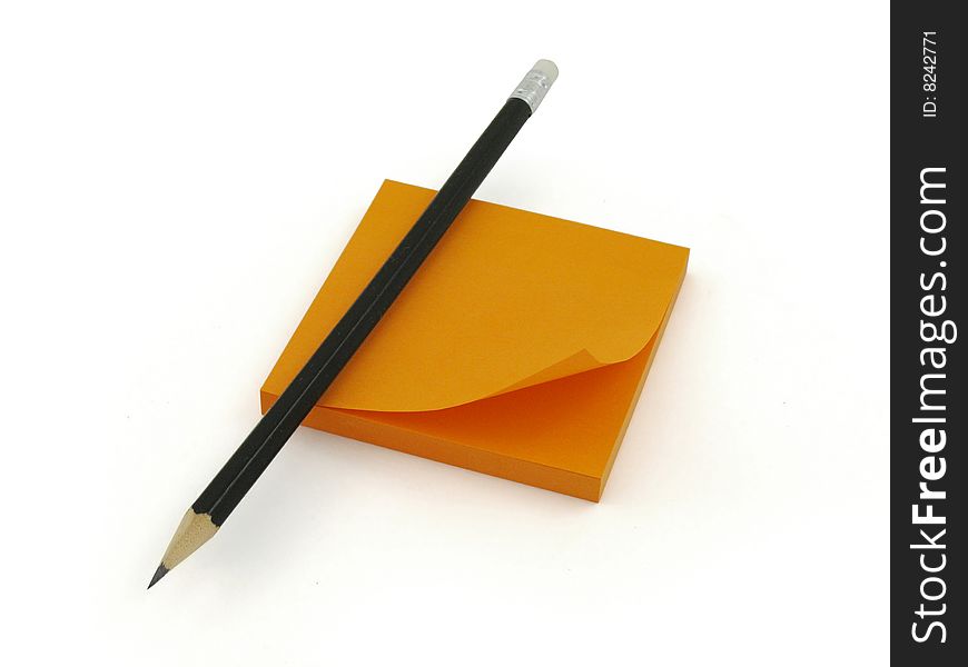 Pencil and orange sticker, white background