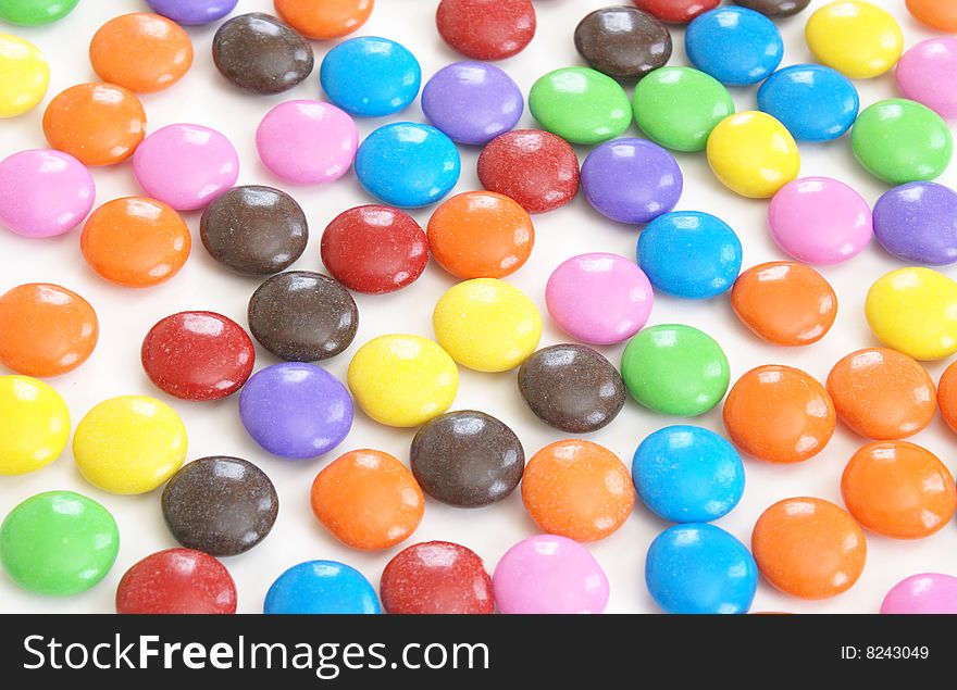 A macro of a colorful display of coated candy. A macro of a colorful display of coated candy.