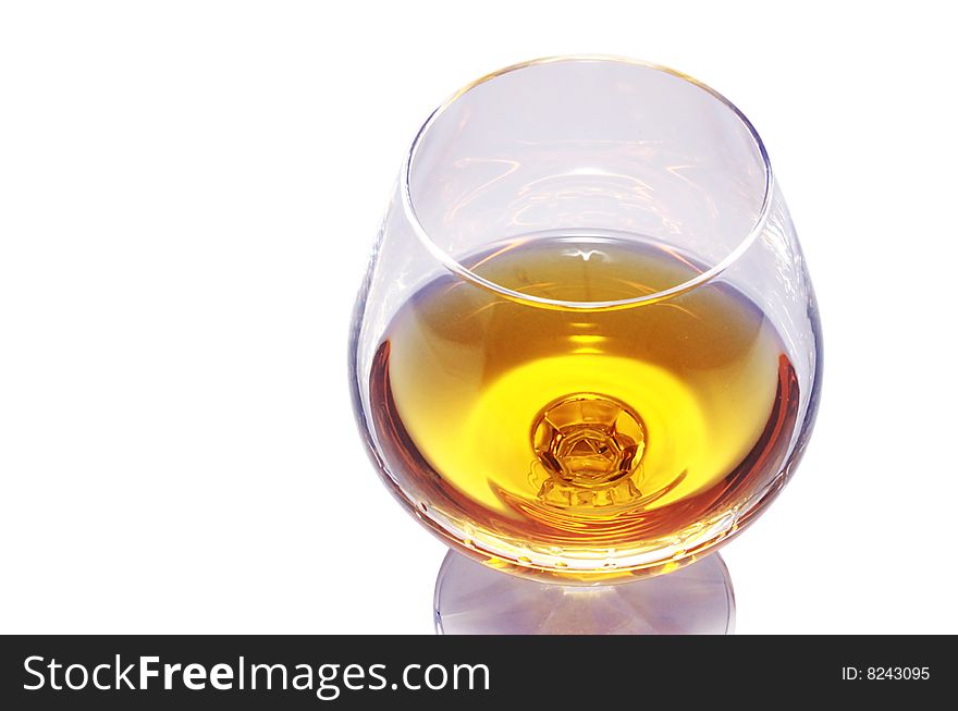 Wineglass with cognac isolated over white. Wineglass with cognac isolated over white