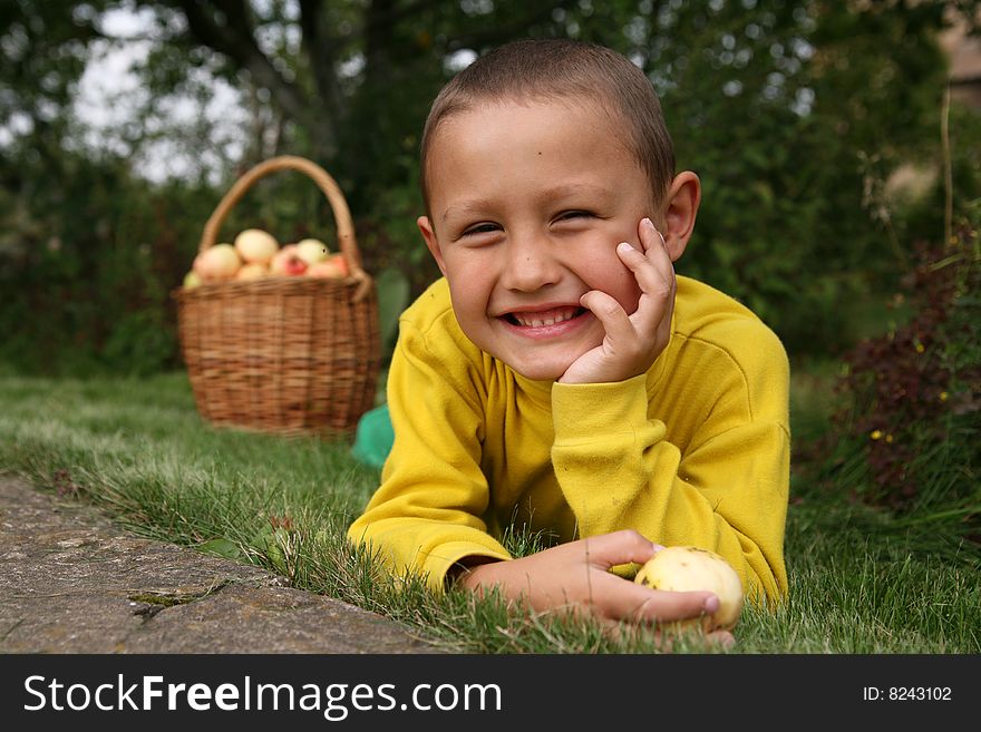 Boy posing outdoors with apples. Boy posing outdoors with apples