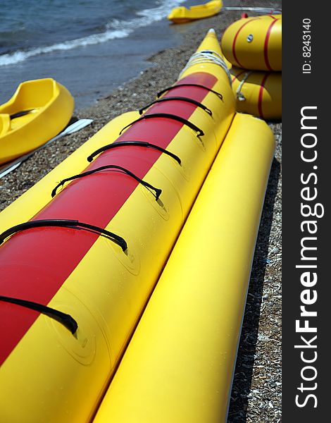 Yellow inflatable boats for entertainment, ashore sea