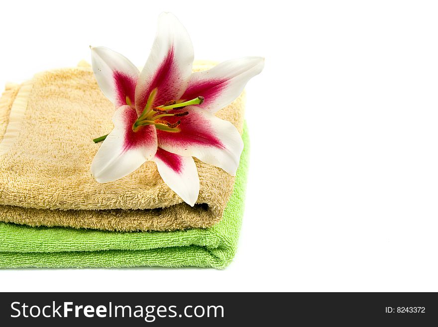 Towels and flower isolated on a white background