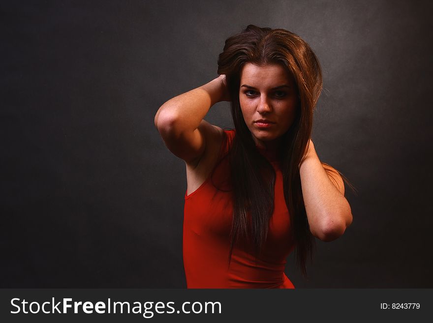 Young attractive girl in the soft studio light. Young attractive girl in the soft studio light.