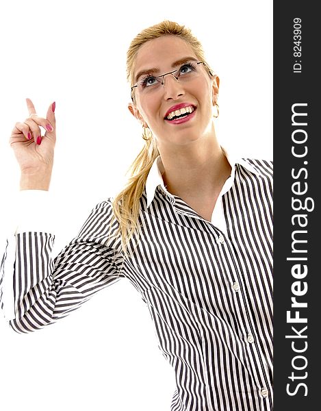 Half length view of businesswoman pointing up with white background