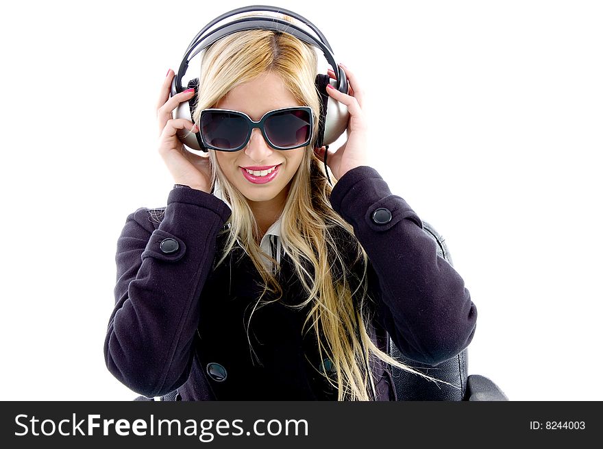 Portrait of woman enjoying music on an isolated white background