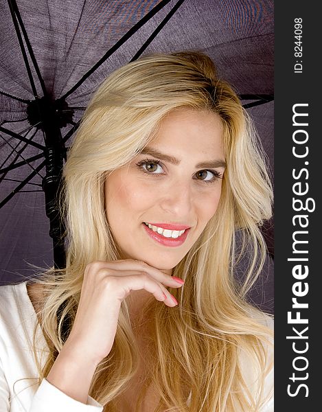 The front view of smiling woman holding an umbrella