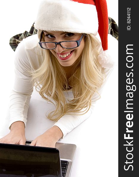 High angle view of woman in christmas hat working on laptop on an isolated white background