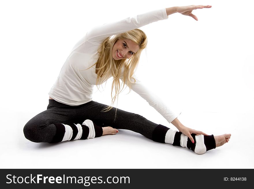 Front view of woman stretching on an isolated white background