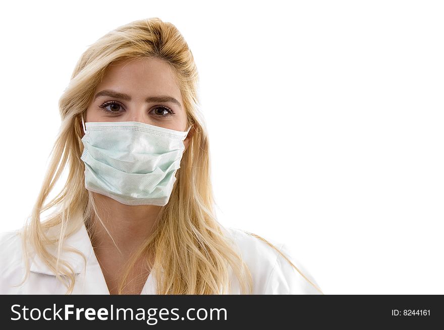 Front view of female surgeon with face mask against white background