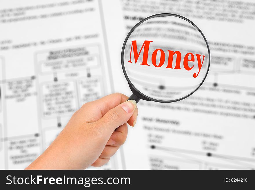 Magnifying glass in hand and word Money, business background