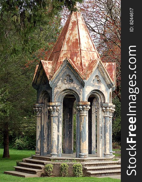 A top of a church cut off and made as a little building that looks like a gazebo. A top of a church cut off and made as a little building that looks like a gazebo.