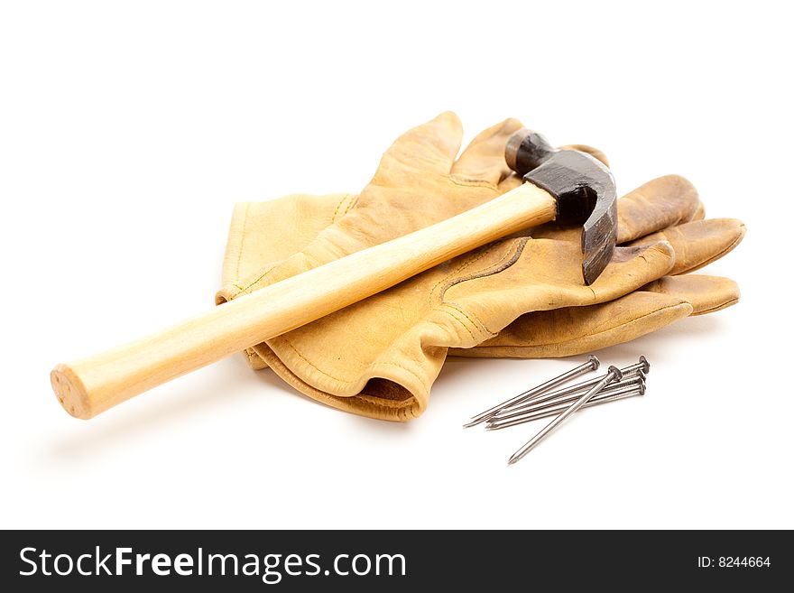 Hammer, Gloves and Nails Isolated on a White Background.