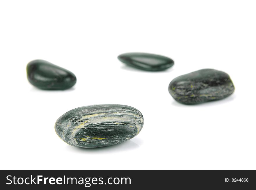 Black river rocks isolated against a white background