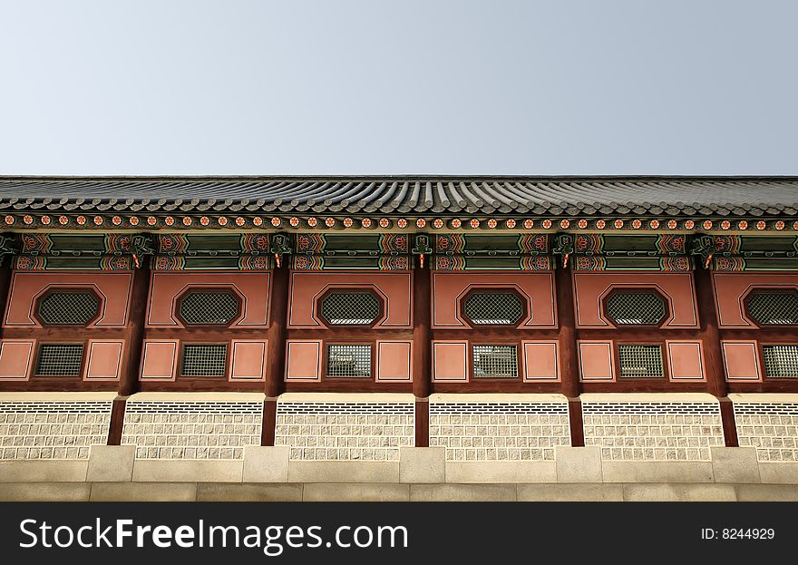 Long Asian Temple Wall against blue sky