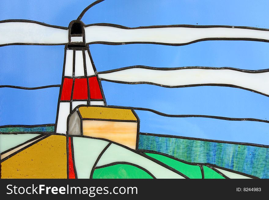 Stainglass lighthouse with clouds and blue sky.