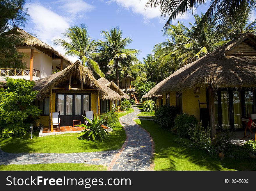 Bungalows of tropical beach resort at sunny day