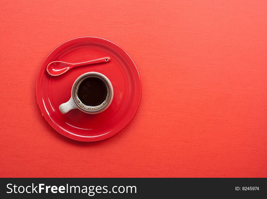 Coffee cup on red table. Many lot of copyspace