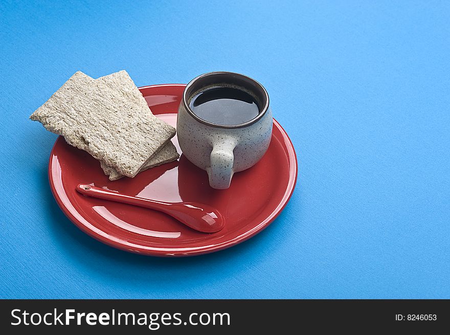 Breakfast. Coffee cup and toasts on blue table. Many lot of copyspace