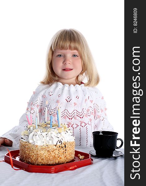 Little girl with birthday cake isolated on white