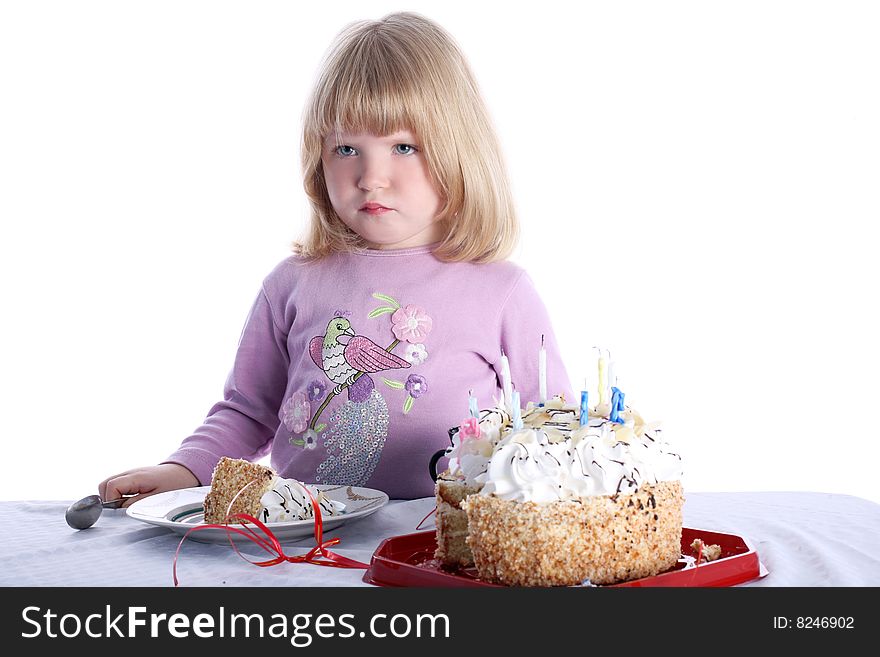 Disaffected girl with birthday cake isolated on white. Disaffected girl with birthday cake isolated on white