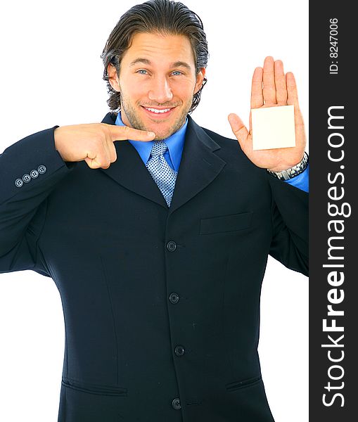 Happy young businessman showing and point to his hand with empty post it note. Happy young businessman showing and point to his hand with empty post it note