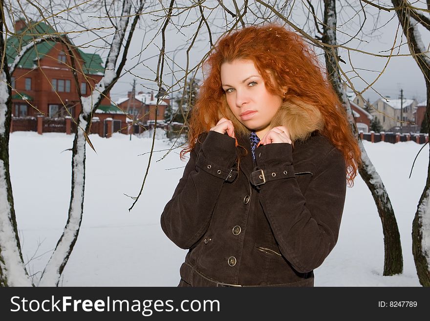 Portrait of the young beautiful woman with red hair. Portrait of the young beautiful woman with red hair