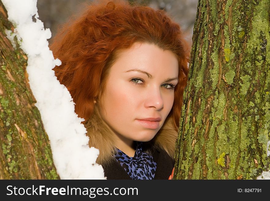 Portrait of the young beautiful woman with red hair. Portrait of the young beautiful woman with red hair