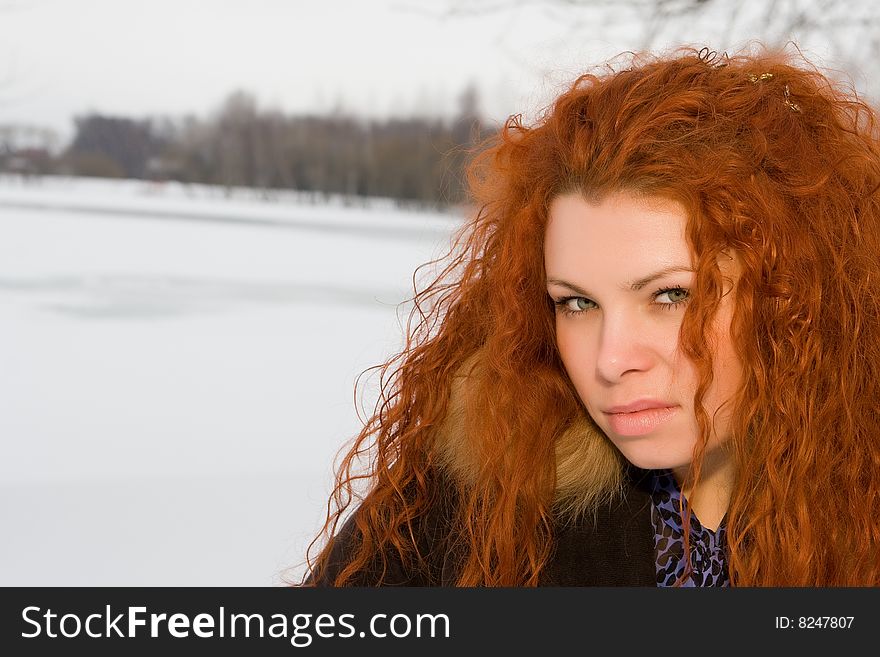 Portrait of the young beautiful woman with red hair. Portrait of the young beautiful woman with red hair