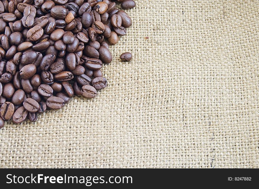 Coffee beans on a burlap texture
