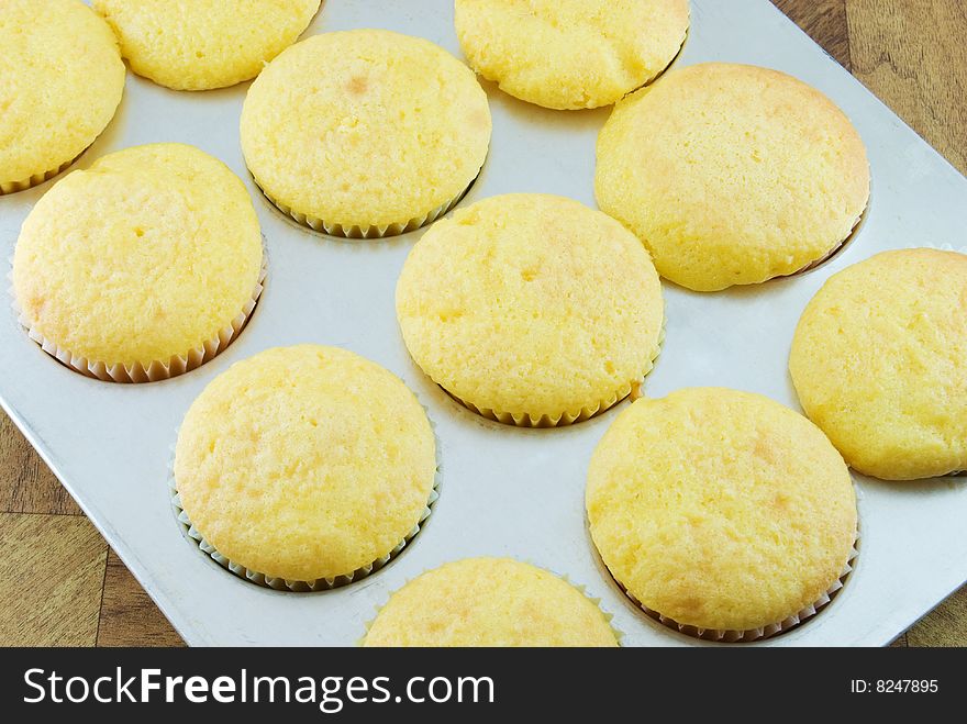 Pan of freshly baked cupcakes