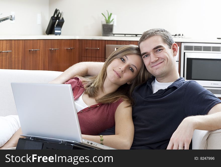 Attractive young couple in a fresh, modern home. Attractive young couple in a fresh, modern home.