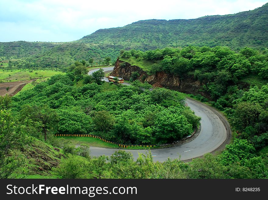 A majestic and picturesque express highway turn in a Indian village. A majestic and picturesque express highway turn in a Indian village.