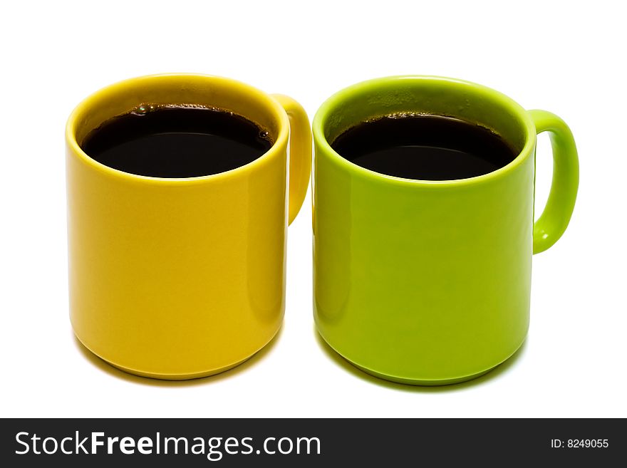 Yellow and green mug on a white background