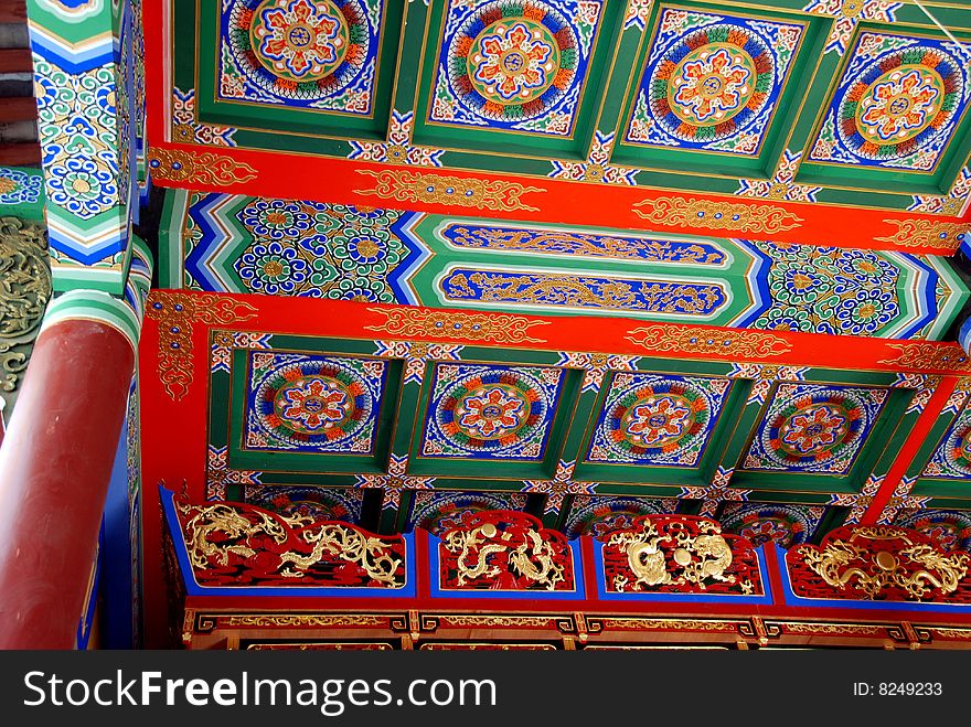 Extraordinary painted ceiling in traditional red, green, and blue colours in the entrance pavilion to the centuries-old Long Xing Temple in Pengzhou, Sichuan province, China - Lee Snider Photo. Extraordinary painted ceiling in traditional red, green, and blue colours in the entrance pavilion to the centuries-old Long Xing Temple in Pengzhou, Sichuan province, China - Lee Snider Photo.