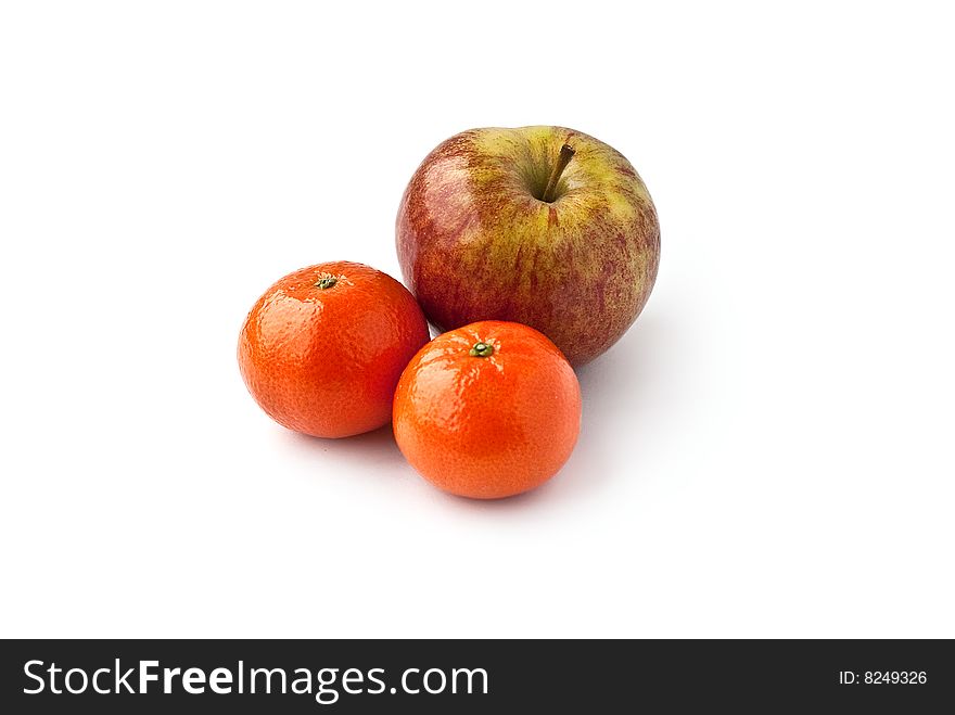 One apple and two mandarins. One apple and two mandarins
