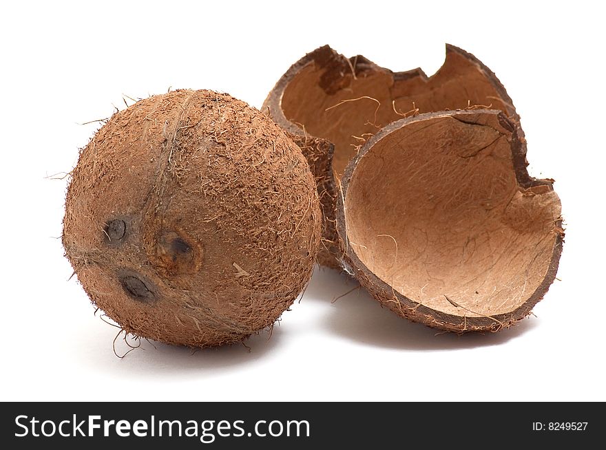 One whole and broken coconut isolated on white background. One whole and broken coconut isolated on white background.