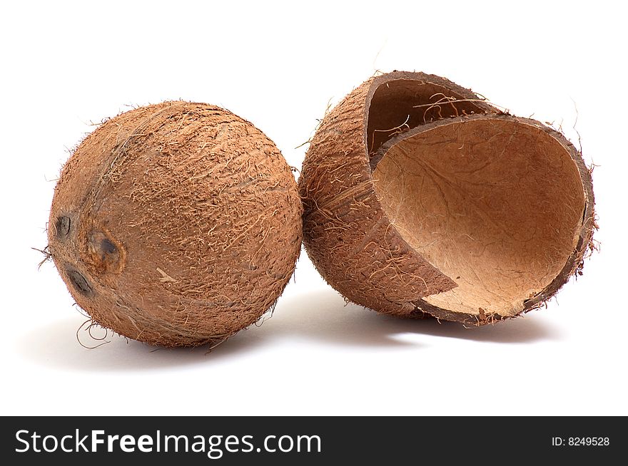 Whole, broken coconuts  isolated on a white background. Whole, broken coconuts  isolated on a white background.