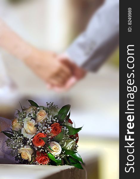 Just married Man and Woman leaved Bride's bouquet after they's Wedding