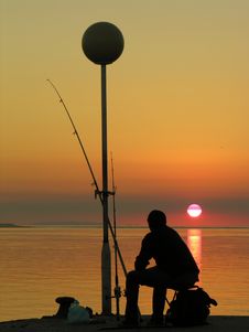 A Fisherman By The Sunset Stock Images A Fisherman By The Sunset Stock Images