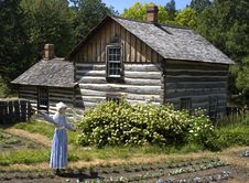 Scarecrow In Farm Garden And Log Cabin Stock Images Scarecrow In Farm Garden And Log Cabin Stock Images