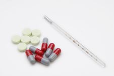 Clinical Thermometer And Pill Stock Photo Clinical Thermometer And Pill Stock Photo