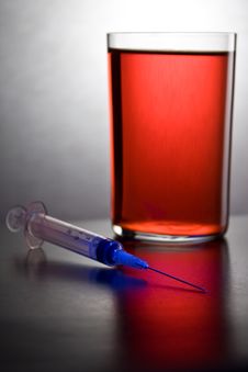 Syringe Into A Glass With Blood Royalty Free Stock Photos Syringe Into A Glass With Blood Royalty Free Stock Photos