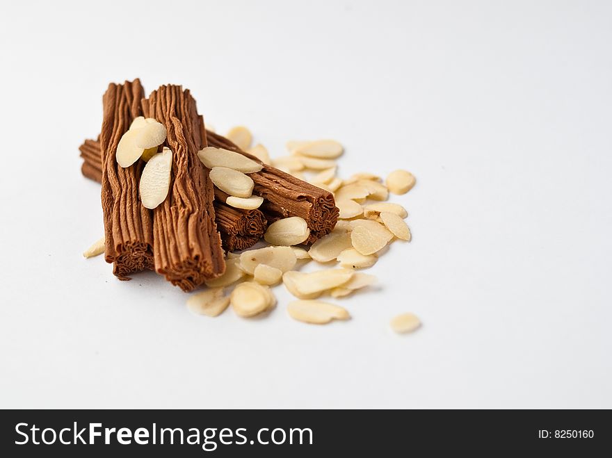 Sweet chocolate sticks whith flaked almond. Sweet chocolate sticks whith flaked almond