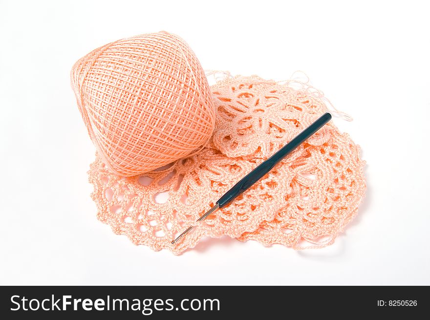 Yarn ball and crochet hook, isolated on white